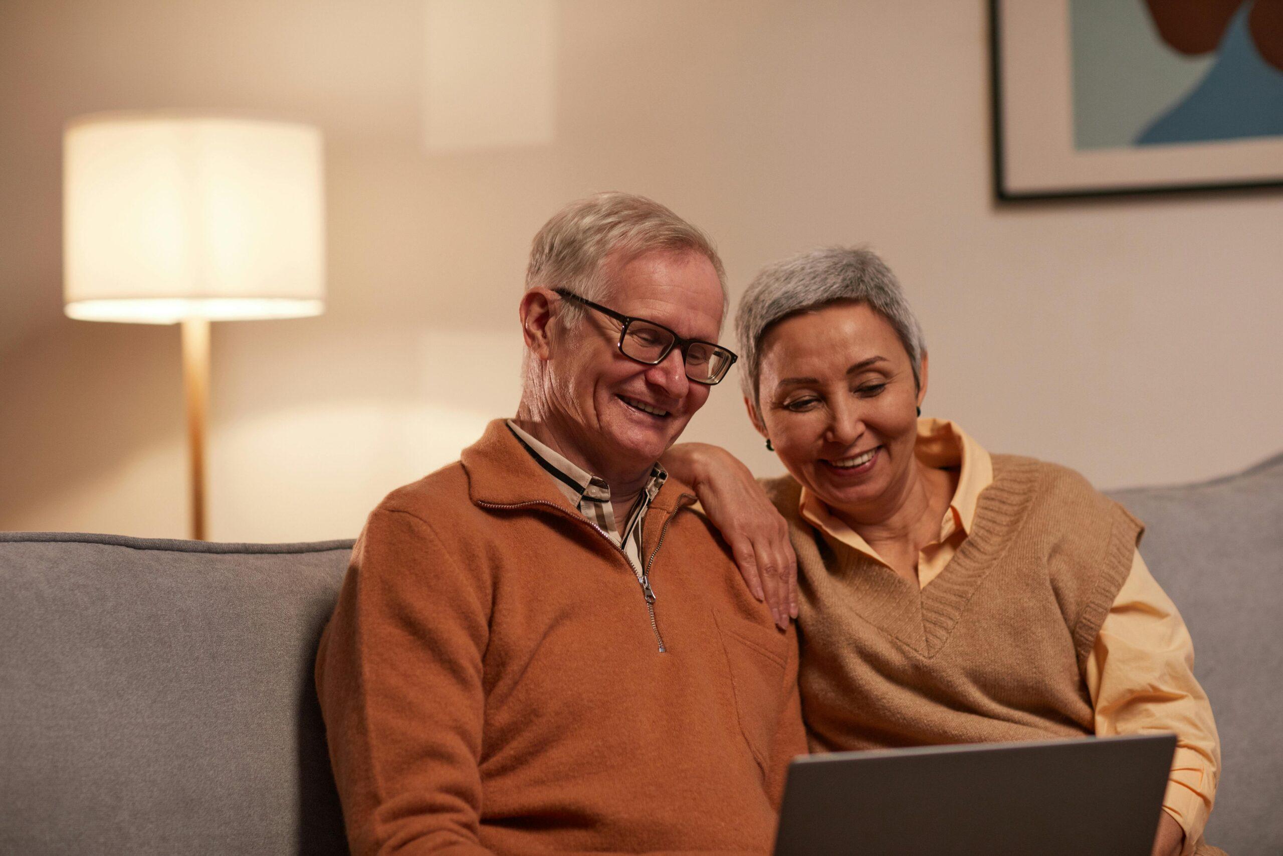 elderly couple reviewing financials